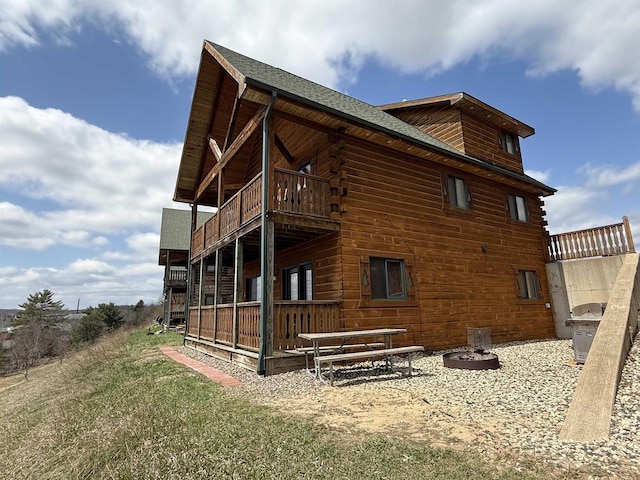 475 Overlook Ct, Warrens, WI 54666 - rear view of house featuring a balcony and log siding