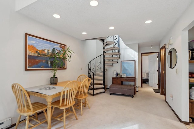dining space with recessed lighting, stairs, baseboard heating, and light carpet