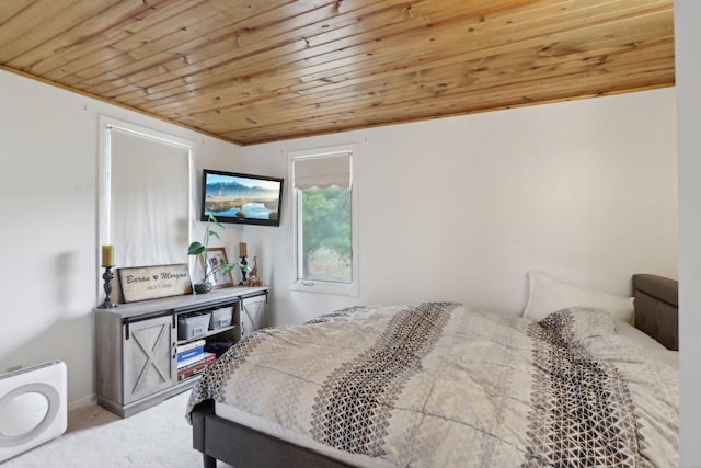 carpeted bedroom featuring wooden ceiling