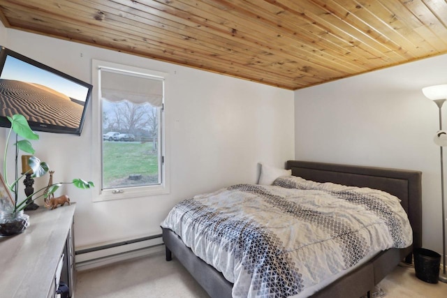 carpeted bedroom featuring wooden ceiling and a baseboard heating unit