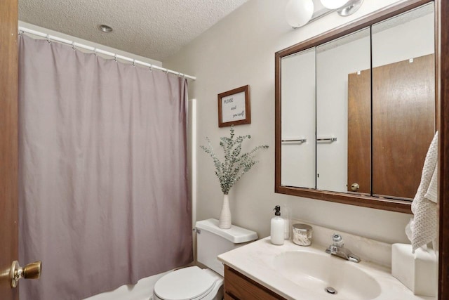 full bathroom with toilet, a textured ceiling, shower / tub combo with curtain, and vanity