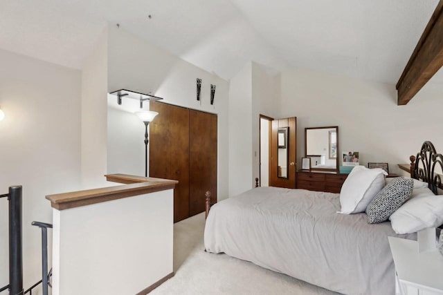 bedroom featuring light colored carpet and lofted ceiling