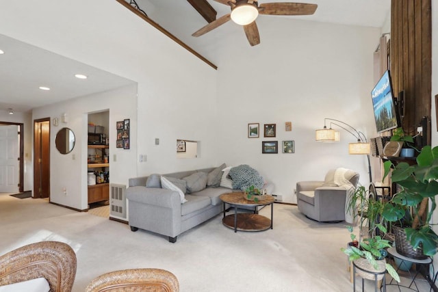 living area featuring baseboards, recessed lighting, light carpet, a ceiling fan, and high vaulted ceiling