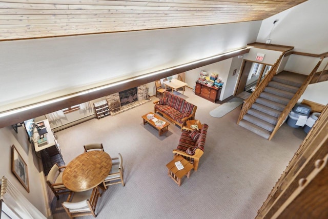 living room featuring wood ceiling, carpet flooring, and vaulted ceiling
