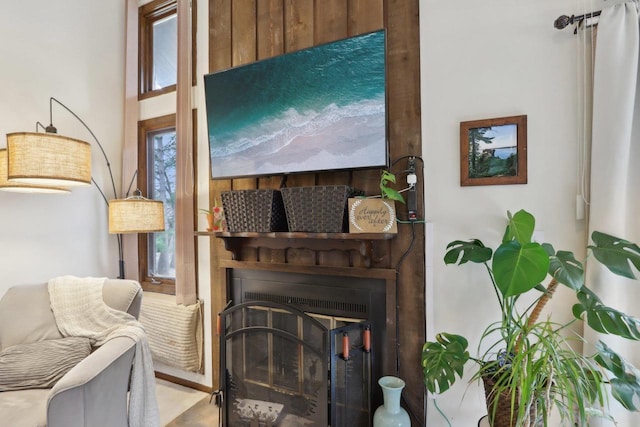 interior space featuring a glass covered fireplace