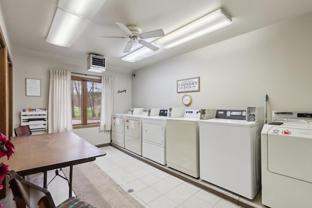 community laundry room with a ceiling fan and washing machine and clothes dryer