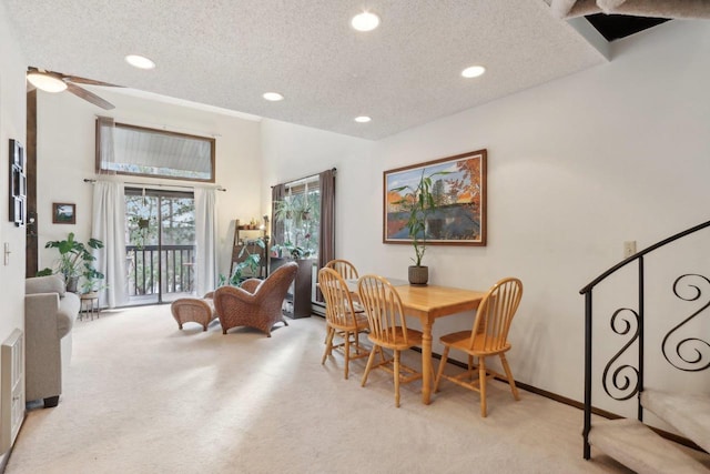 dining space featuring a textured ceiling, ceiling fan, recessed lighting, and carpet flooring