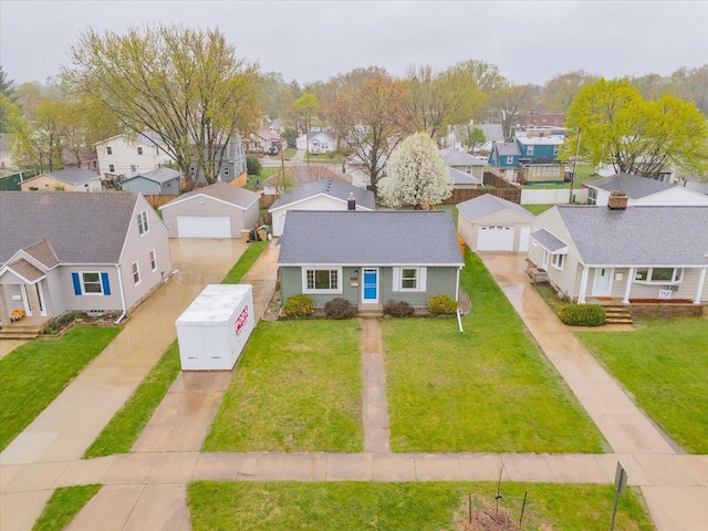 birds eye view of property with a residential view