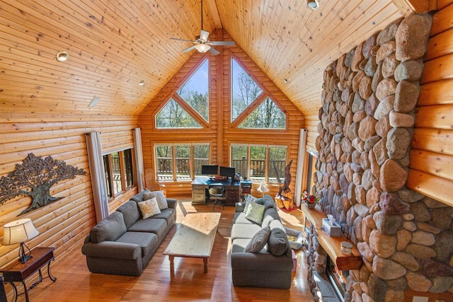 W4895 Big Bay Rd, Necedah, WI 54646 - living area featuring log walls, wooden ceiling, high vaulted ceiling, hardwood / wood-style flooring, and ceiling fan