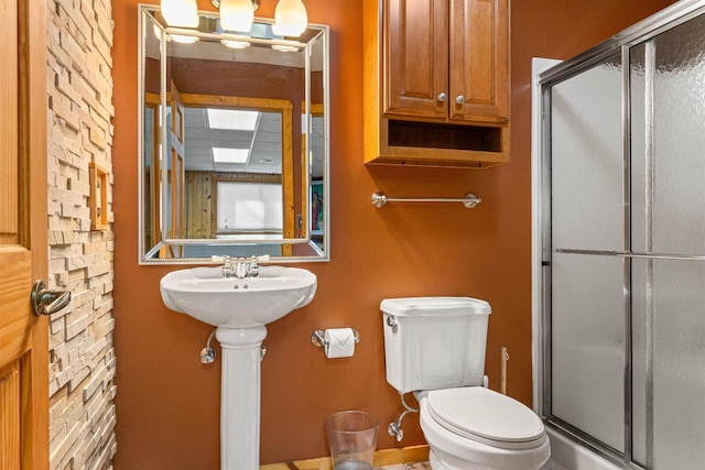 W4895 Big Bay Rd, Necedah, WI 54646 - full bathroom featuring a stall shower, toilet, and a sink