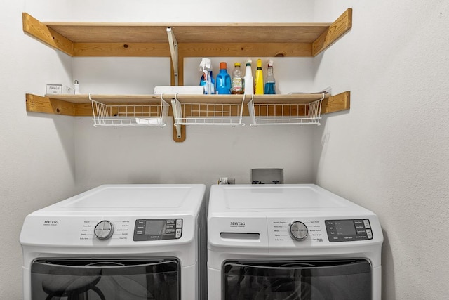 washroom featuring independent washer and dryer and laundry area