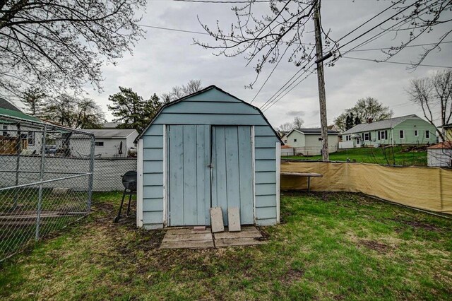 view of shed featuring a fenced backyard