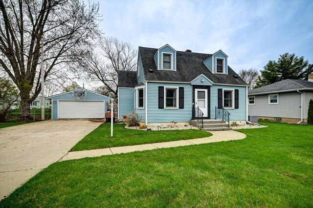 cape cod home featuring a garage, roof with shingles, an outdoor structure, and a front lawn