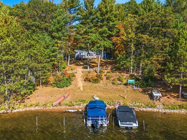 N1115 Spotted Fawn Trl, Keshena, WI 54135 - view of yard with boat lift, a boat dock, and a water view
