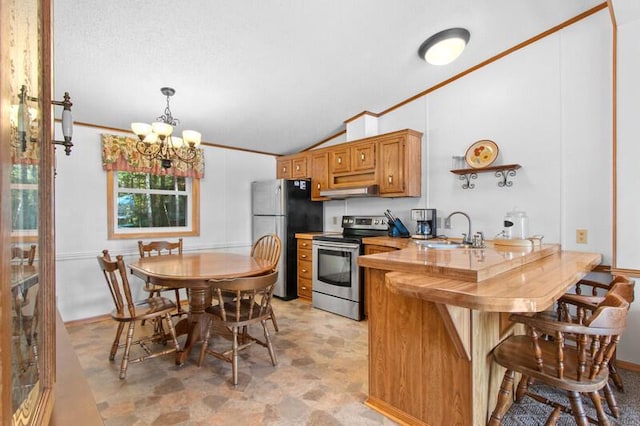 N1115 Spotted Fawn Trl, Keshena, WI 54135 - kitchen with appliances with stainless steel finishes, a sink, lofted ceiling, a chandelier, and crown molding