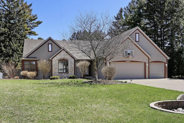 view of front of home with stone siding, a front lawn, driveway, and roof with shingles
