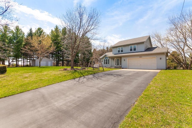 N4893 N Helenville Rd, Helenville, WI 53137 - traditional home with an attached garage, aphalt driveway, and a front lawn