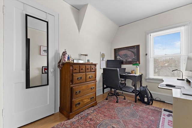 office space featuring baseboards and wood finished floors