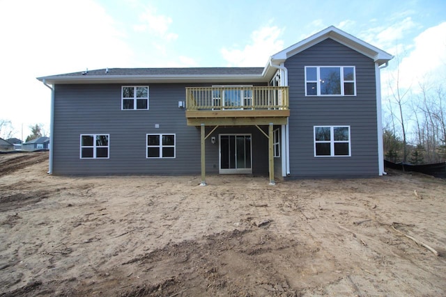 rear view of house with a wooden deck