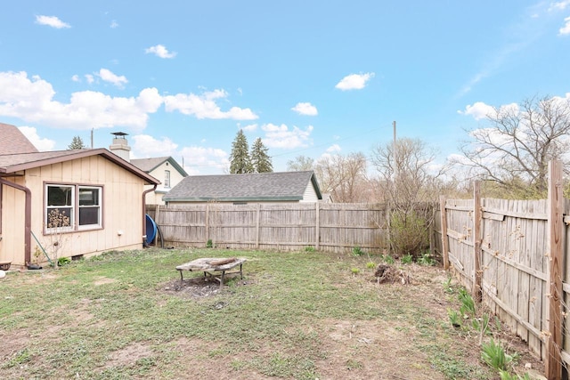 view of yard with a fenced backyard