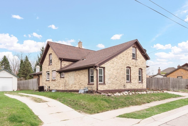 view of home's exterior featuring a chimney, fence, central AC unit, and driveway