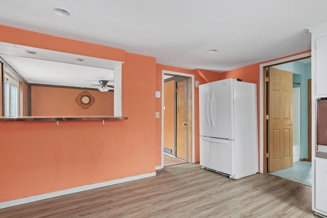 unfurnished room with recessed lighting, a ceiling fan, baseboards, and light wood-style floors