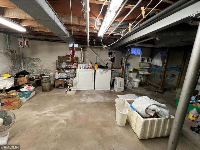 318 2nd Ave, Milltown, WI 54858 - unfinished below grade area featuring electric panel and washing machine and clothes dryer