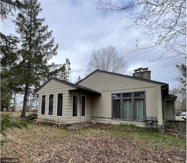 318 2nd Ave, Milltown, WI 54858 - rear view of house with a chimney