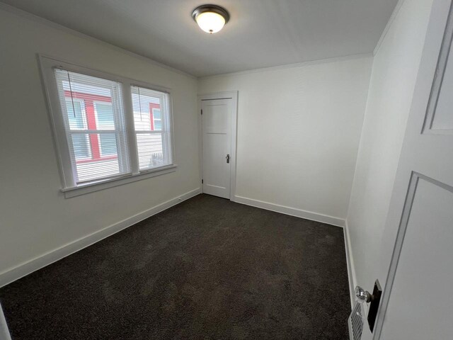 4631 N 37th St, Milwaukee, WI 53209 - unfurnished room with crown molding, baseboards, and dark colored carpet