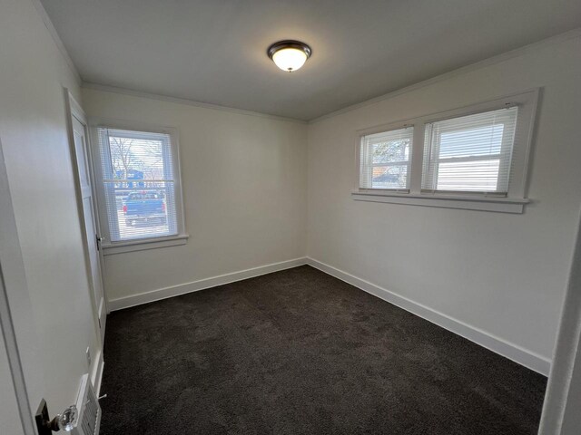 4631 N 37th St, Milwaukee, WI 53209 - empty room featuring dark carpet, ornamental molding, and baseboards