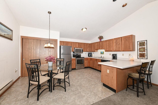 kitchen with a notable chandelier, a peninsula, appliances with stainless steel finishes, lofted ceiling, and a baseboard radiator