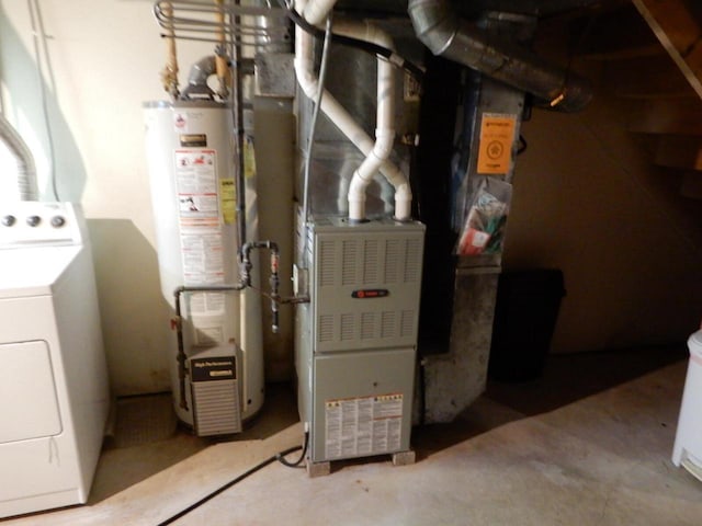 utilities featuring washer / dryer and gas water heater