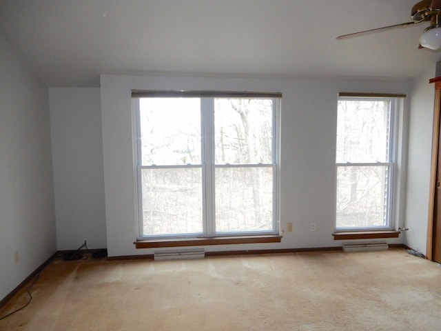 unfurnished room with carpet, ceiling fan, and visible vents