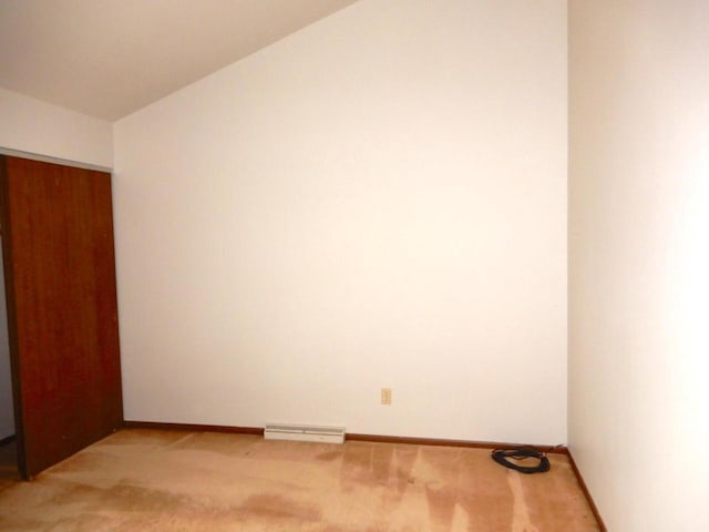 spare room featuring visible vents, baseboards, and light carpet