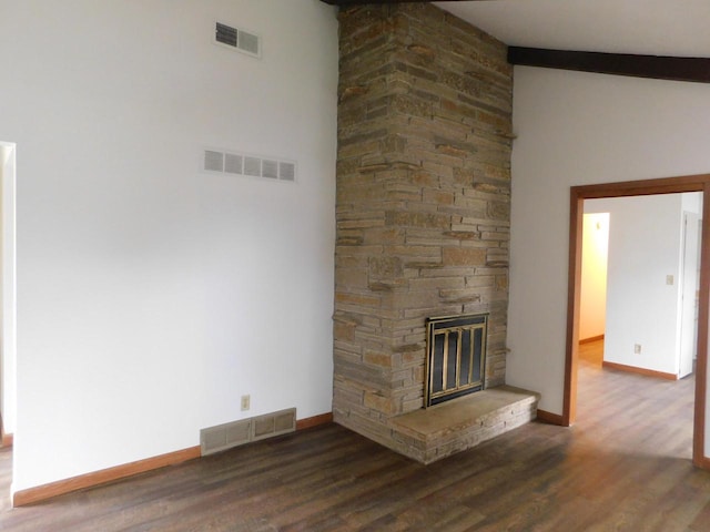 unfurnished living room with baseboards, wood finished floors, and visible vents