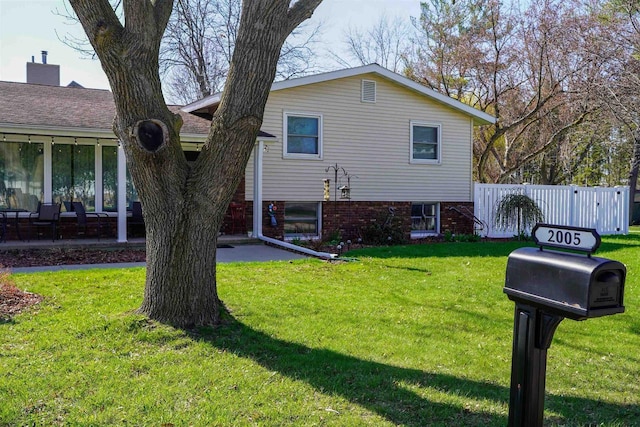 2005 Hollister Ave, Tomah, WI 54660 - view of front of house with fence and a front lawn