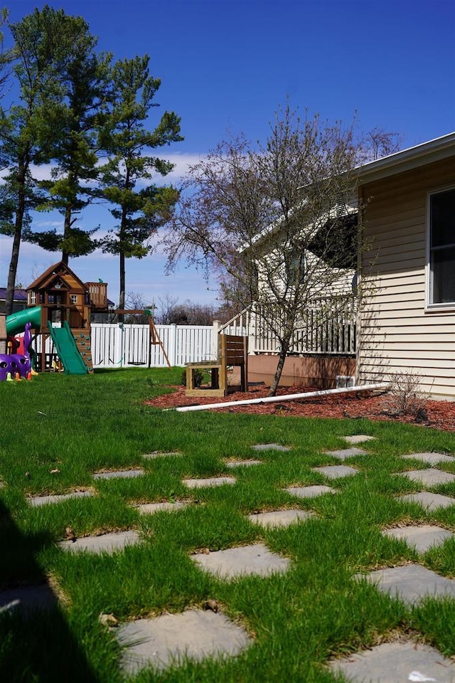 2005 Hollister Ave, Tomah, WI 54660 - view of yard featuring a playground and fence