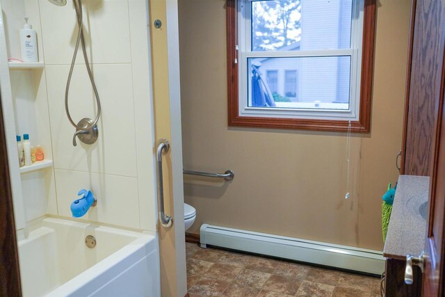 2005 Hollister Ave, Tomah, WI 54660 - full bath featuring toilet, baseboards, and a baseboard radiator