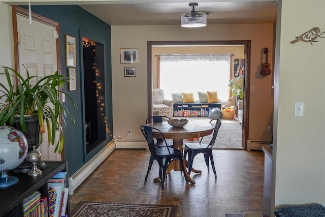 2005 Hollister Ave, Tomah, WI 54660 - dining space featuring baseboards and a baseboard heating unit