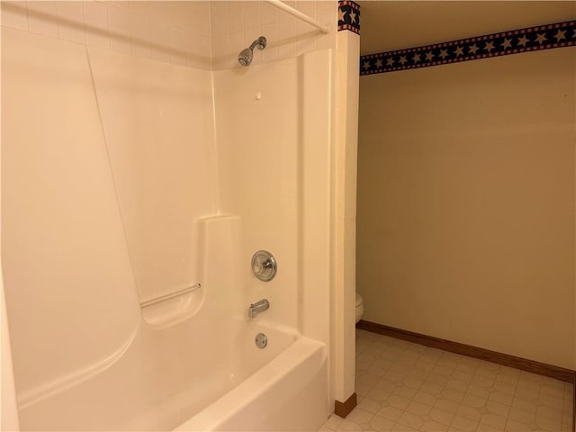 full bath with baseboards,  shower combination, and toilet