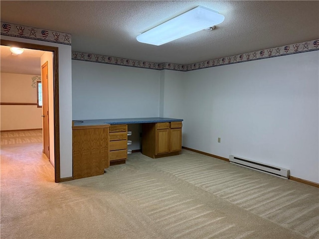 unfurnished office with a textured ceiling, baseboards, light carpet, and a baseboard radiator