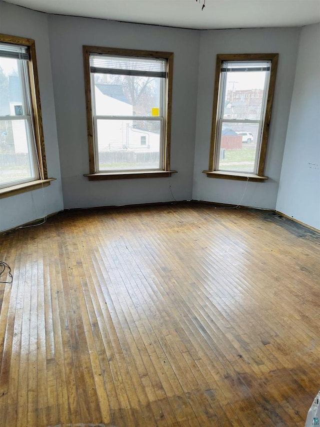2002 Banks Ave, Superior, WI 54880 - empty room featuring hardwood / wood-style floors and plenty of natural light