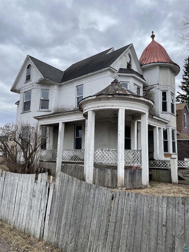 2002 Banks Ave, Superior, WI 54880 - victorian-style house with fence, covered porch, and a shingled roof