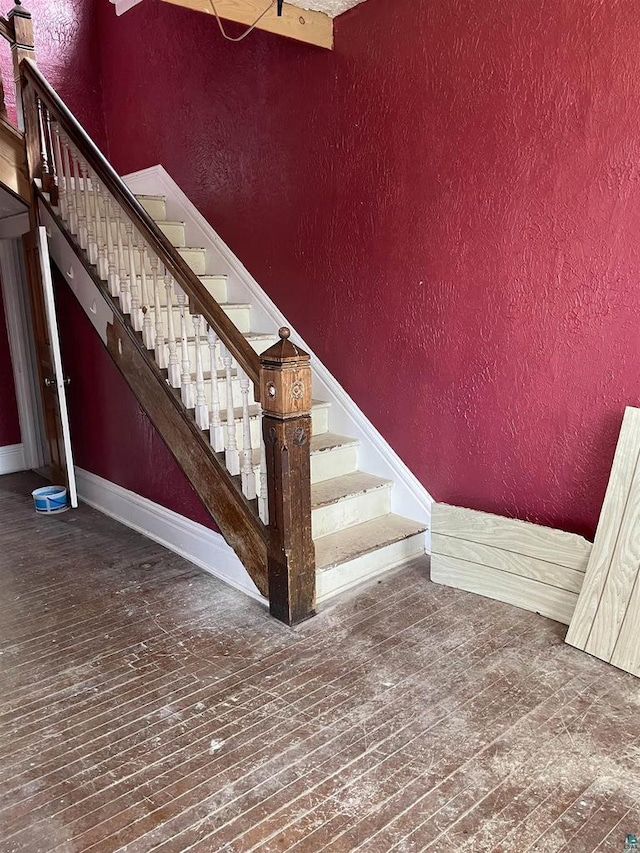 2002 Banks Ave, Superior, WI 54880 - stairs with a textured wall, hardwood / wood-style flooring, and baseboards