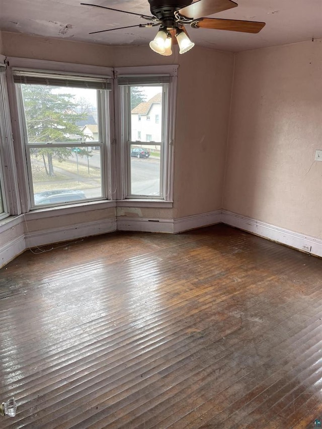 2002 Banks Ave, Superior, WI 54880 - spare room with a ceiling fan, dark wood finished floors, and baseboards