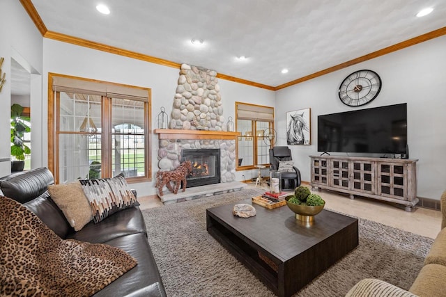 living room featuring recessed lighting, a stone fireplace, and crown molding