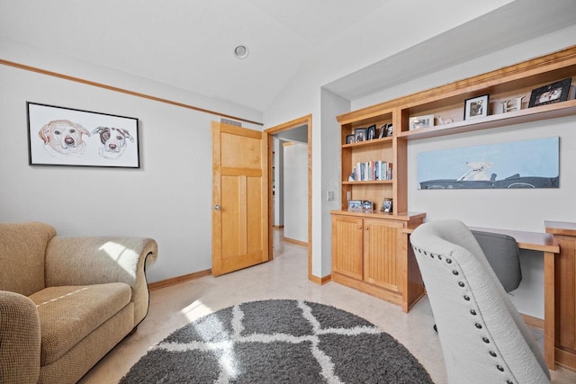 office featuring baseboards and lofted ceiling