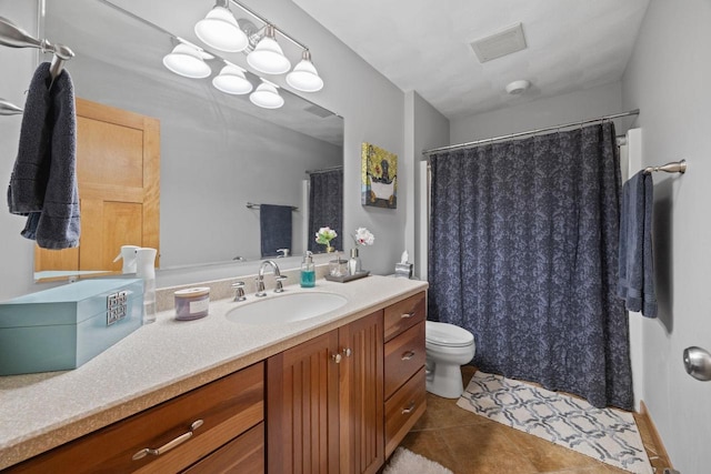 bathroom with tile patterned flooring, a shower with curtain, toilet, vanity, and visible vents