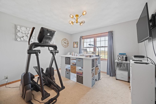exercise area with a notable chandelier, light carpet, and baseboards