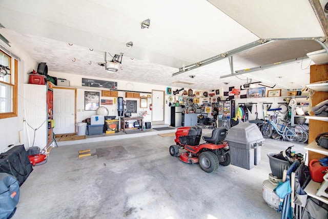 garage featuring a workshop area and a garage door opener
